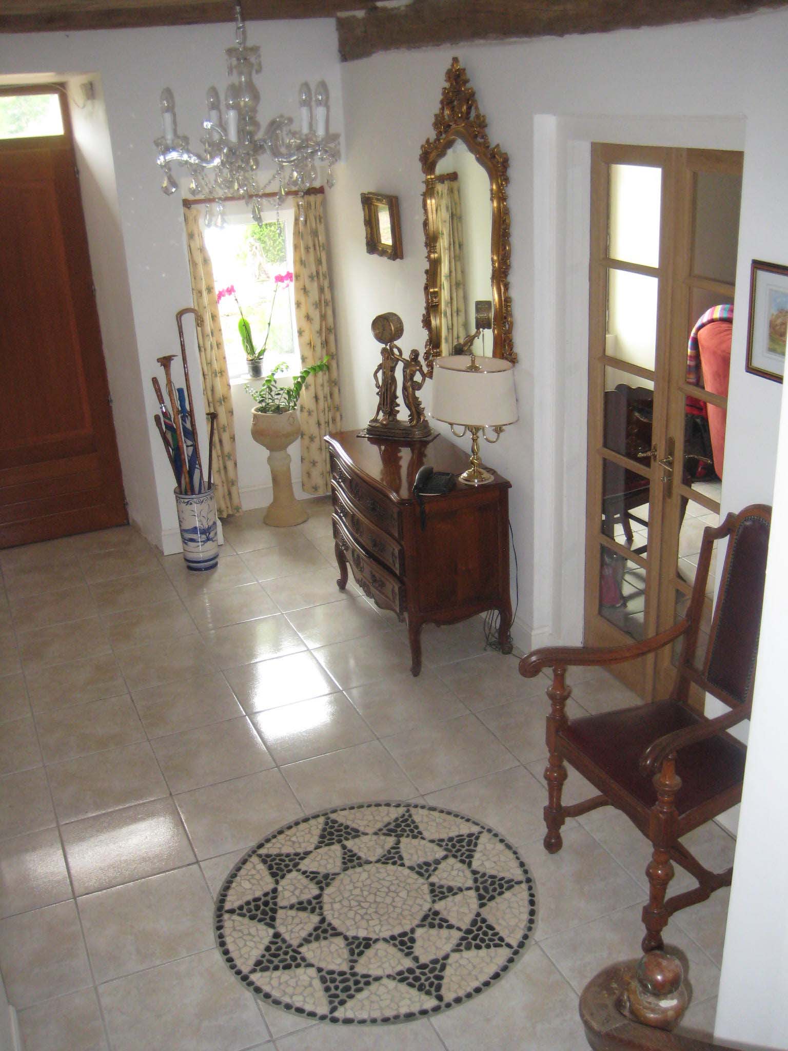 The entrance hall seen from the oak spiral staircase