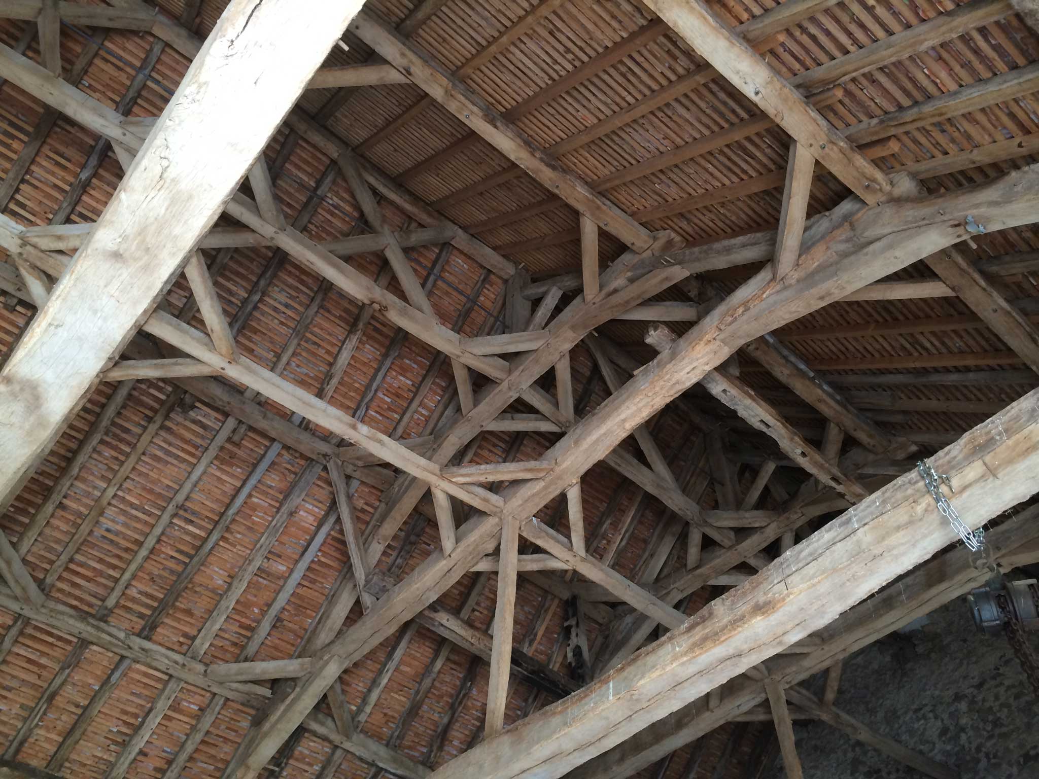 16th-century lattice-work roof timbers inside the open barn
